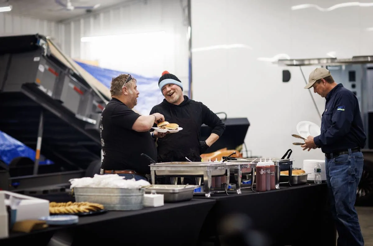 People standing in a buffet line getting lunch